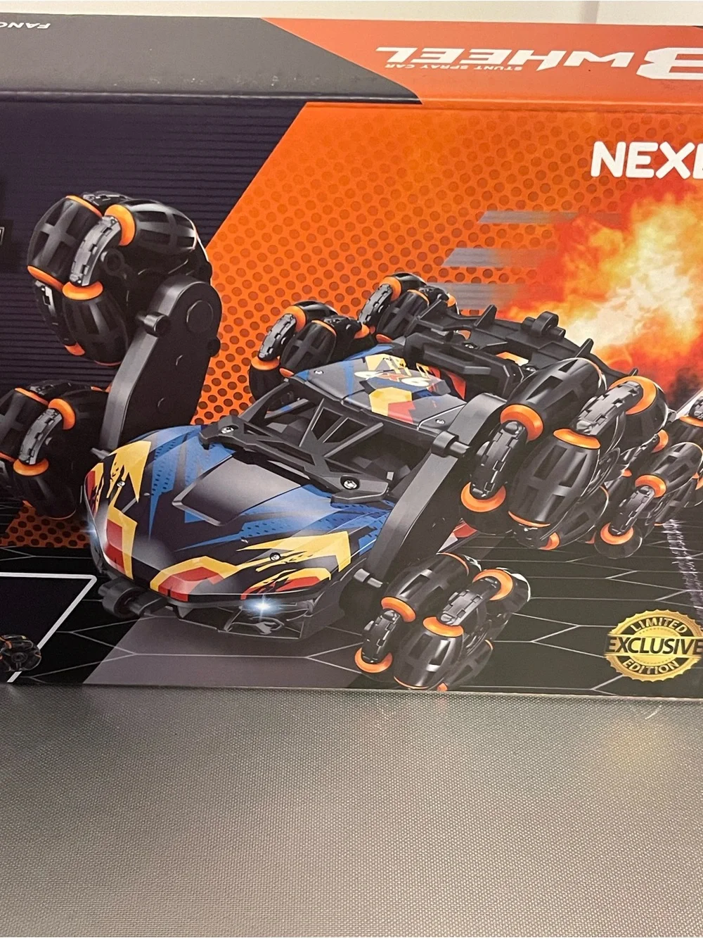 Nexbox 8-Wheel Stunt Spray RC Car - Black with Orange Accent NIP